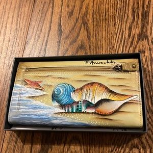 Anuschka accordion flap wallet.
